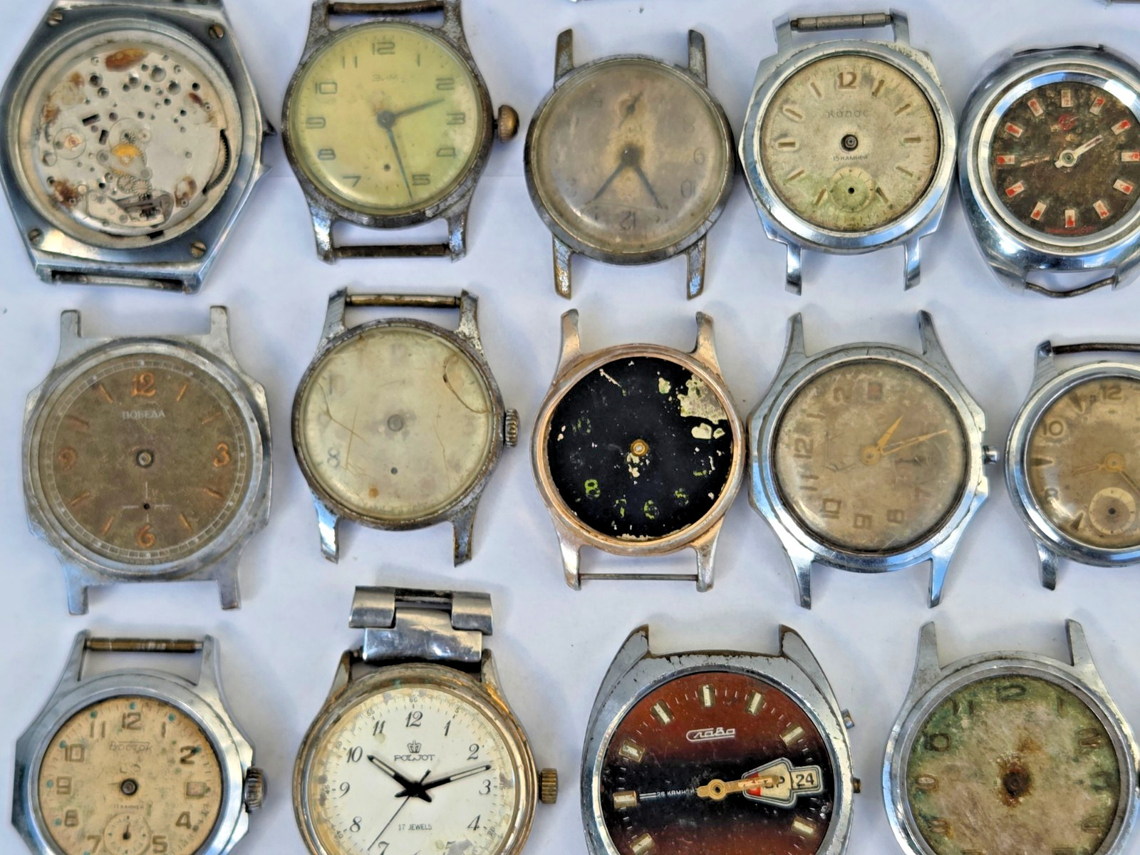 Lot of 75 Russian Watches Vostok Pobeda Mayak Zim etc Not working for parts Read