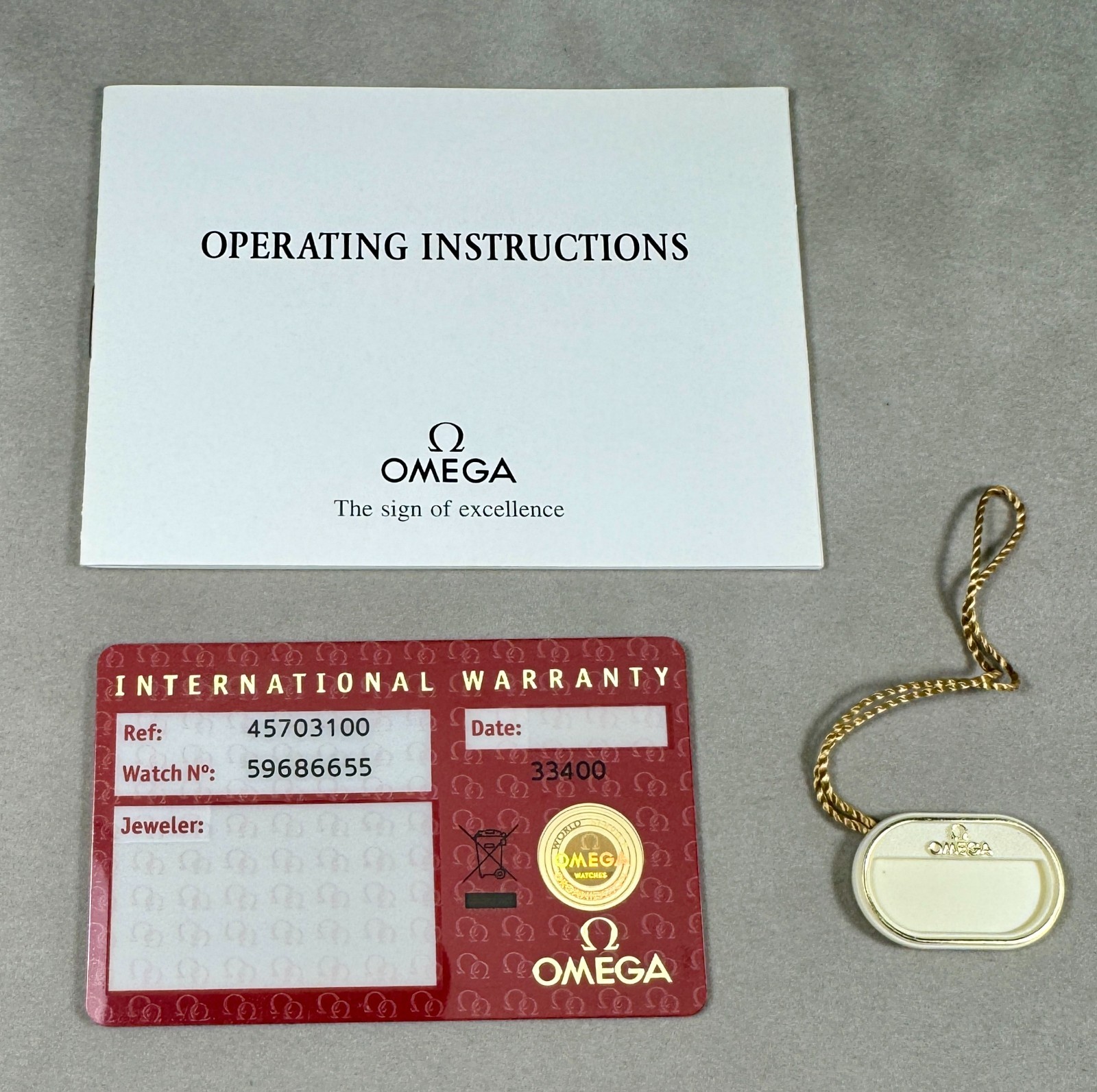 Omega Watch International Warranty Card, Hang-Tag and Instructions Booklet