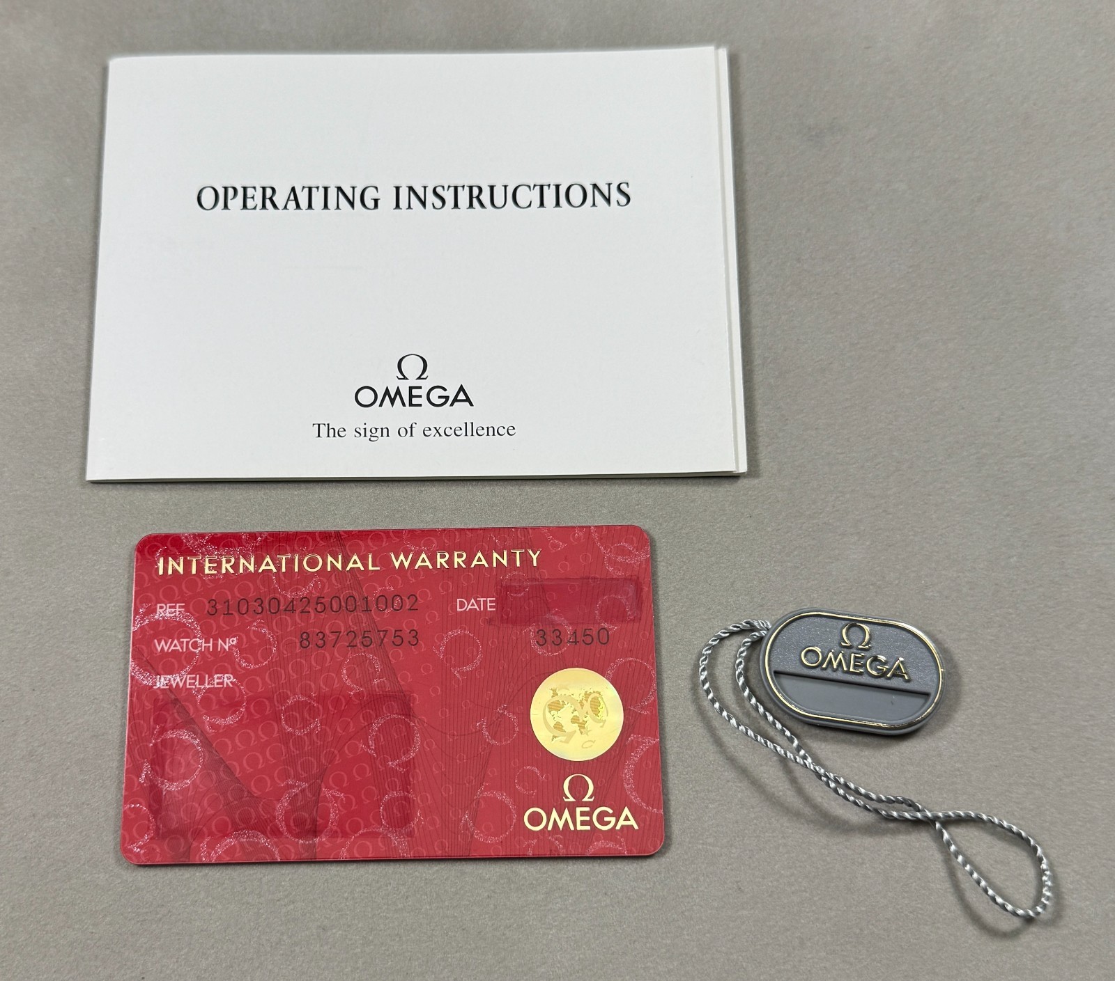 Omega Watch International Warranty Card, Hang-Tag and Instructions Booklet set