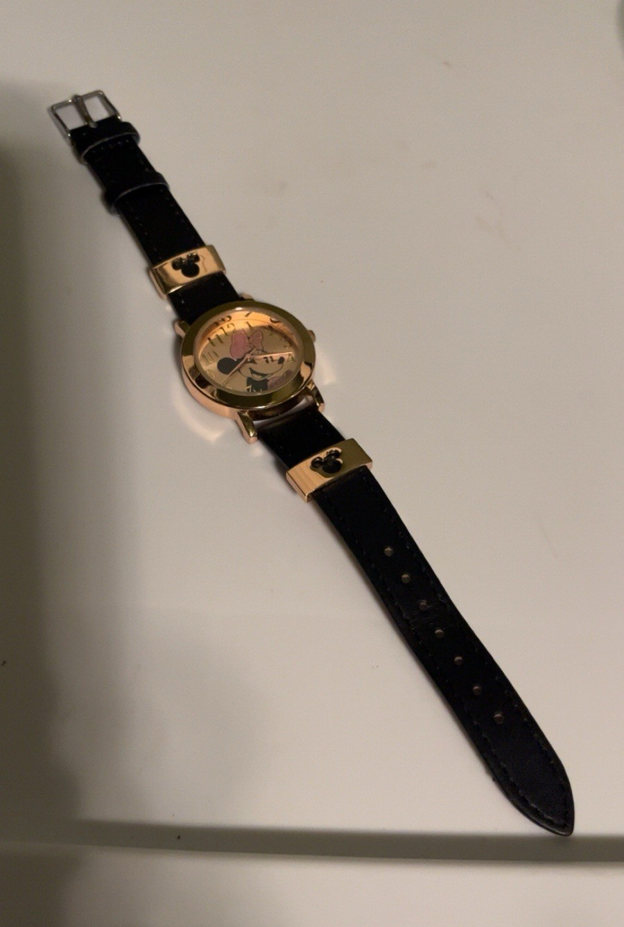 Disney Women’s Quartz Analog Watch Gold Tone Dial Arabic Numerals Black Leather