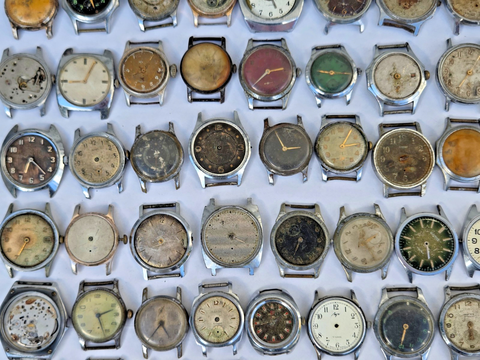Lot of 75 Russian Watches Vostok Pobeda Mayak Zim etc Not working for parts Read