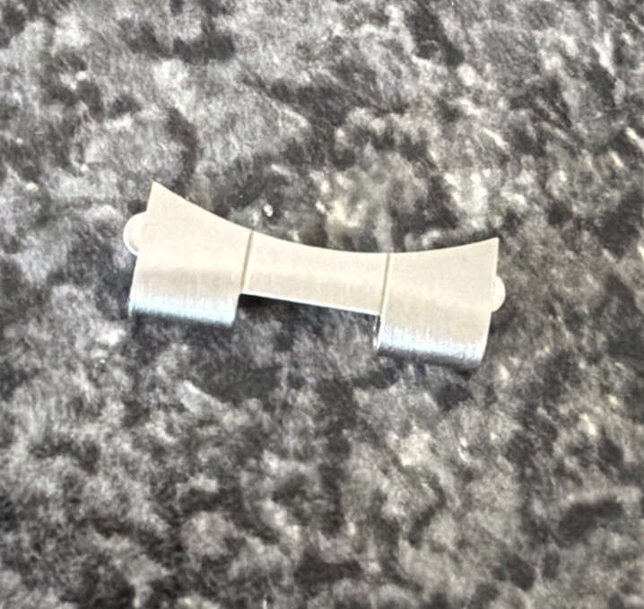 GENUINE ROLEX BRACELET END PIECE 557 AS SHOWN.