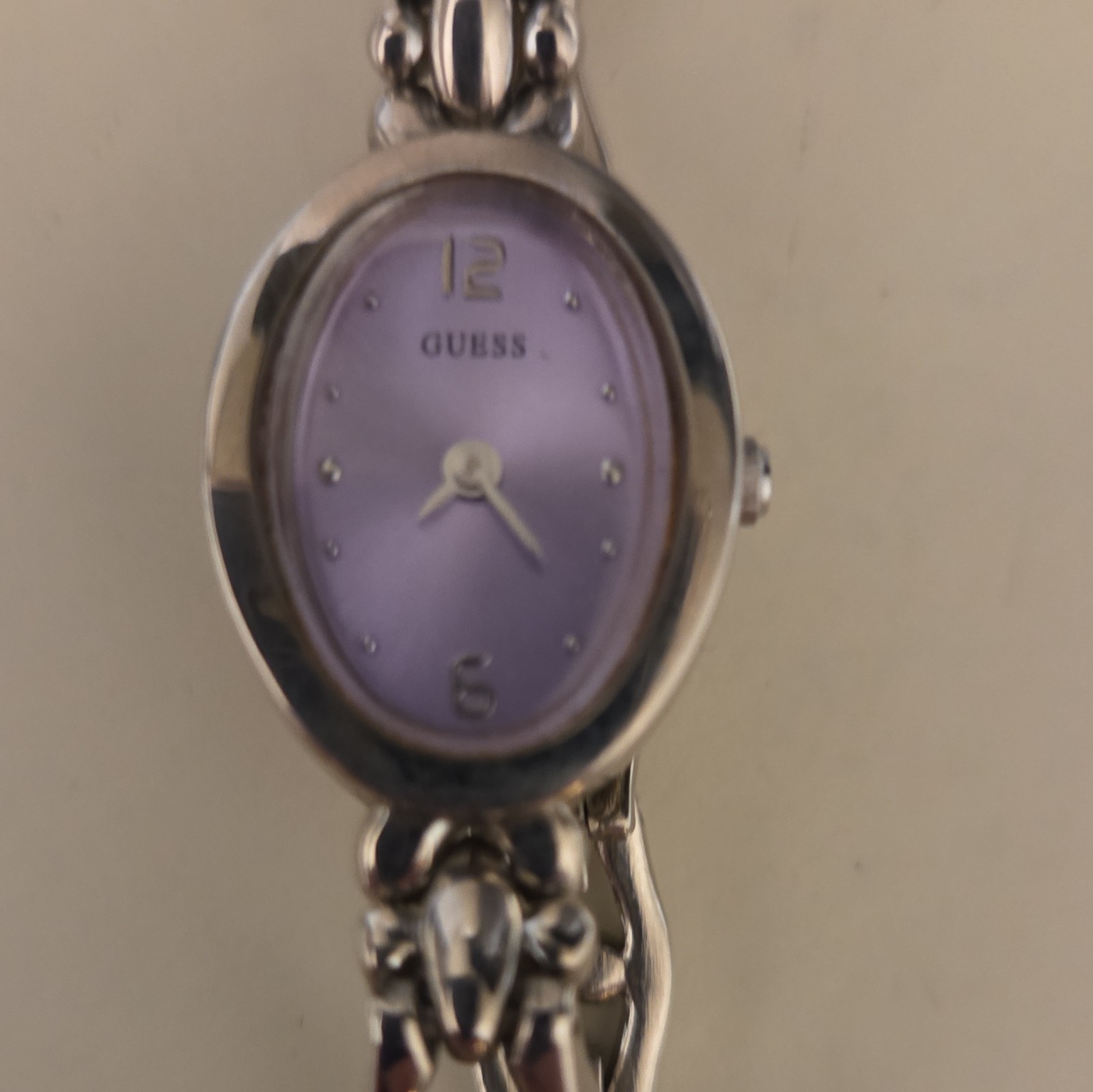 GUESS Women’s Analog Silver Tone Oval Watch Purple Dial Metal Bracelet